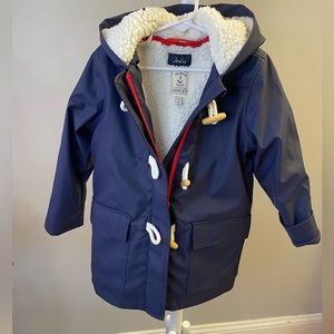 Navy Blue, waterproof, fleece lined, hooded, 2 pockets, zipper, toggle buttons.
